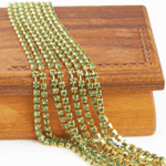 2.4 mm rhinestone chain with Erinite Preciosa crystals in raw setting x 40 cm