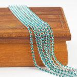 2.1 mm rhinestone chain with Blue Zircon Preciosa crystals in silver setting x 20 cm
