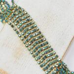 2 mm rhinestone chain with Deep Sea AB Preciosa crystals in raw setting x 20 cm