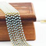 2.1 mm rhinestone chain with Light Sapphire Opal Preciosa crystals in raw setting x 40 cm