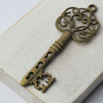 61x21 mm Antique bronze charm Whiplash Key x 1 pc(s)