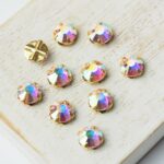 6 mm / ss30 Preciosa sew-on rhinestone Crystal AB in Gold-colored setting x 10 pc(s)