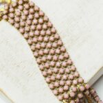 2.4 mm rhinestone chain with Vintage Rose Opaque in raw setting x 40 cm