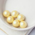 10 mm Preciosa Nacre round pearls Pearlescent Yellow x 10 pc(s)