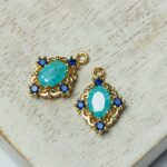 10x14 mm Gold-colored Maharaja Oval Glass pendant Ice Blue x 2 pc(s)
