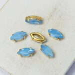 5x10 mm Navette glass cabochon Air Blue Opal with gold-colored claw x 6 pc(s)