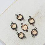 6 mm / ss29 Preciosa connector Light Peach in Black setting x 6 pc(s)