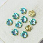 6 mm / ss30 Preciosa sew-on rhinestone Aqua Bohemica AB in Gold-colored setting x 10 pc(s)