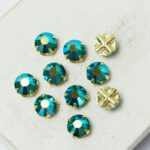 6 mm / ss30 Preciosa sew-on rhinestone Emerald AB in Gold-colored setting x 10 pc(s)