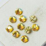 6 mm / ss30 Preciosa sew-on rhinestone Light Topaz AB in Gold-colored setting x 10 pc(s)