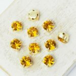 6 mm / ss29 Preciosa Chaton Montee Topaz in Gold-colored setting x 10 pc(s)