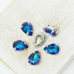 7x10 mm drop glass cabochon Bermuda Blue with silver-colored claw x 6 pc(s)