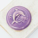 36 mm  Dolphin Waves Beadingschool Art Cabochon Mauve on light clay x 1 pc(s)