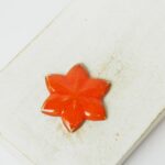 24x27 mm Small Star Beadingschool Art Cabochon Orange on light clay x 1 pc(s)