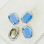 10x14 mm oval glass cabochon Sapphire Opal AB with silver-colored claw x 4 pc(s)