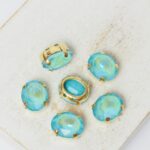 8x10 mm oval glass cabochon Aquamarine Shine with gold-colored claw x 6 pc(s)