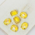 8x10 mm oval glass cabochon Light Topaz Shine with gold-colored claw x 6 pc(s)