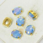 8x10 mm oval glass cabochon Sapphire Opal AB with gold-colored claw x 6 pc(s)