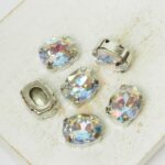 8x10 mm oval glass cabochon Blue Lagoon AB with silver-colored claw x 6 pc(s)