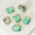 8x10 mm oval glass cabochon Pacific Opal AB with silver-colored claw x 6 pc(s)