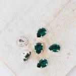 4x6 mm Preciosa Fancy Baroque Pear Emerald with Silver-colored claw x 6 pc(s)