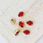 4x6 mm Preciosa Fancy Baroque Pear Light Siam with Gold-colored claw x 6 pc(s)