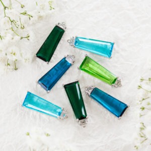 Trapezoid glass drops in metal settings