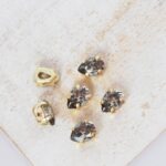 4x6 mm Preciosa Fancy Baroque Pear Black Diamond with Gold-colored claw x 6 pc(s)