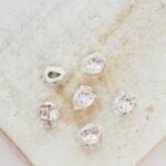 4x6 mm Preciosa Fancy Baroque Pear Crystal with Silver-colored claw x 6 pc(s)