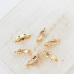 3x11 mm Preciosa Fancy Slim Navette Light Peach with Gold-colored claw x 6 pc(s)