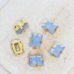 7x9 mm rectangle glass cabochon Sapphire Opal AB with gold-colored claw x 6 pc(s)