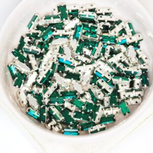 3x7 mm Preciosa Fancy Baguette Emerald with Silver-colored claw x 10 pc(s)