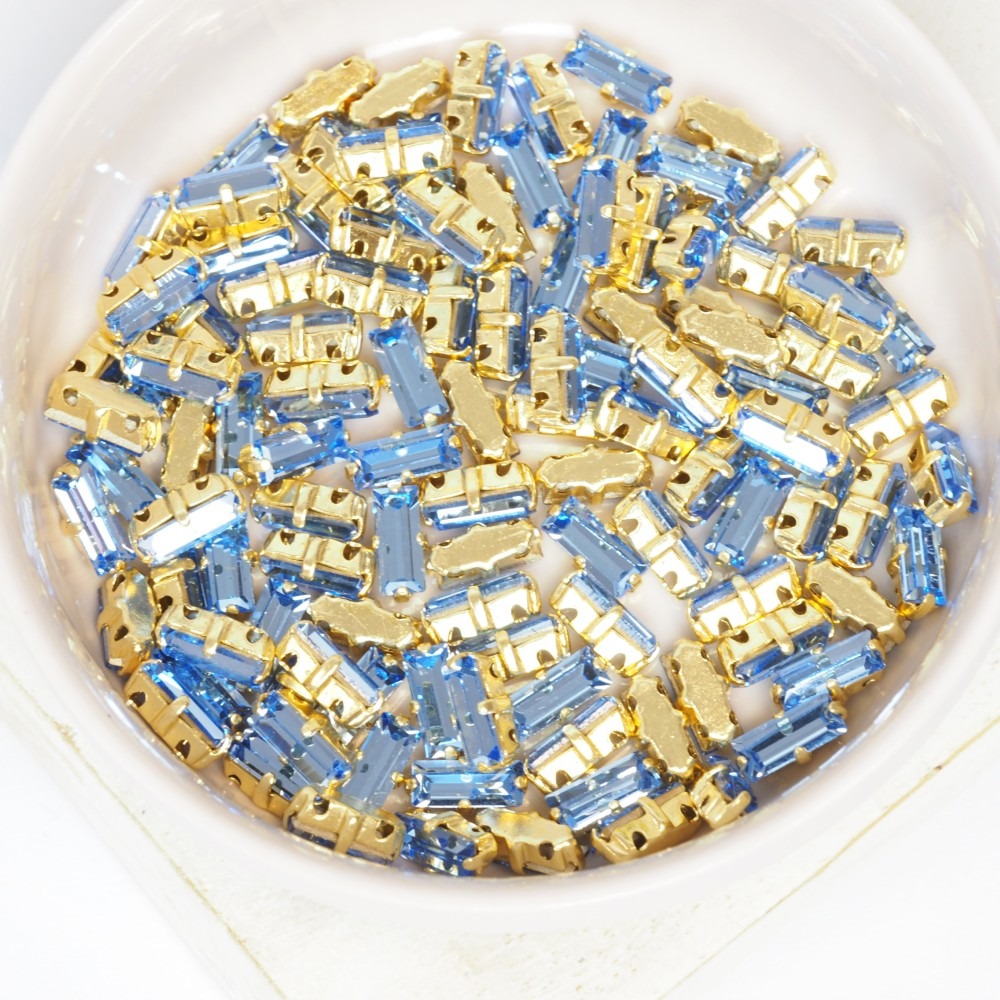 3x7 mm Preciosa Fancy Baguette Light Sapphire with Gold-colored claw x 10 pc(s)