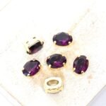 6x8 mm Preciosa Fancy Oval Cabochon Amethyst in Gold-colored setting x 6 pc(s)