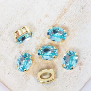 6x8 mm Preciosa Fancy Oval Cabochon Aqua Bohemica in Gold-colored setting x 6 pc(s)