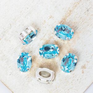 6x8 mm Preciosa Fancy Oval Cabochon Aqua Bohemica in Silver-colored setting x 6 pc(s)