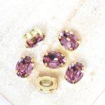 6x8 mm Preciosa Fancy Oval Cabochon Light Amethyst in Gold-colored setting x 6 pc(s)