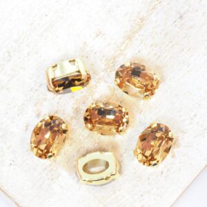 6x8 mm Preciosa Fancy Oval Cabochon Light Colorado Topaz in Gold-colored setting x 6 pc(s)