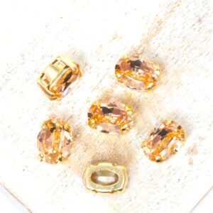 6x8 mm Preciosa Fancy Oval Cabochon Light Peach in Gold-colored setting x 6 pc(s)