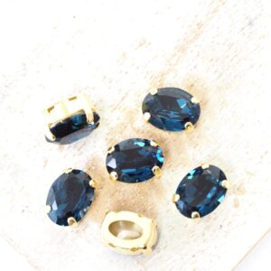 6x8 mm Preciosa Fancy Oval Cabochon Montana in Gold-colored setting x 6 pc(s)