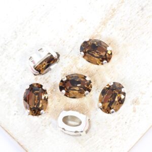 6x8 mm Preciosa Fancy Oval Cabochon Smoked Topaz in Silver-colored setting x 6 pc(s)