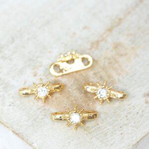 5.5x10 mm Starburst 2 Hole Spacer Bar Gold-colored x 4 pc(s)