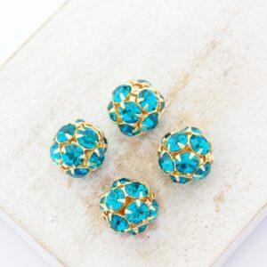 10 mm Preciosa fancy ball bead Blue Zircon in Gold-colored setting x 4 pc(s)