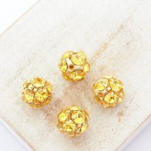 10 mm Preciosa fancy ball bead Light Topaz in Gold-colored setting x 4 pc(s)