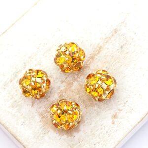 10 mm Preciosa fancy ball bead Topaz in Gold-colored setting x 4 pc(s)